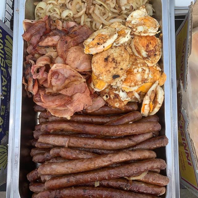 Bacon, eggs and sausages ready for a breakfast barbecue
